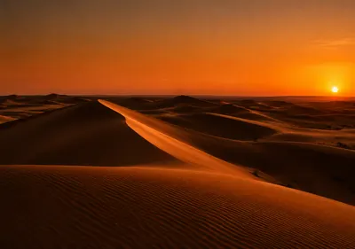 iPhone Duo amber desert wallpaper for the inner display, Wind-carved desert dunes at sunset, amber light, long shadows, and a deep orange horizon. 2670x1878 px