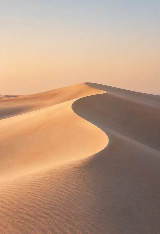 iPhone Duo desert dunes wallpaper for the cover screen, soft wind-carved sand dune curves at low sun, 1398x2034 px