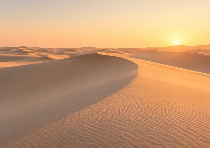 iPhone Duo desert dunes wallpaper for the inner display, a wide field of soft sand dune curves at low sun, 2670x1878 px