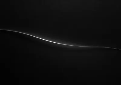 iPhone Duo single line wallpaper for the inner display, A single white line on a near-black field, slightly off-center, with a soft graphite shadow. 2670x1878 px